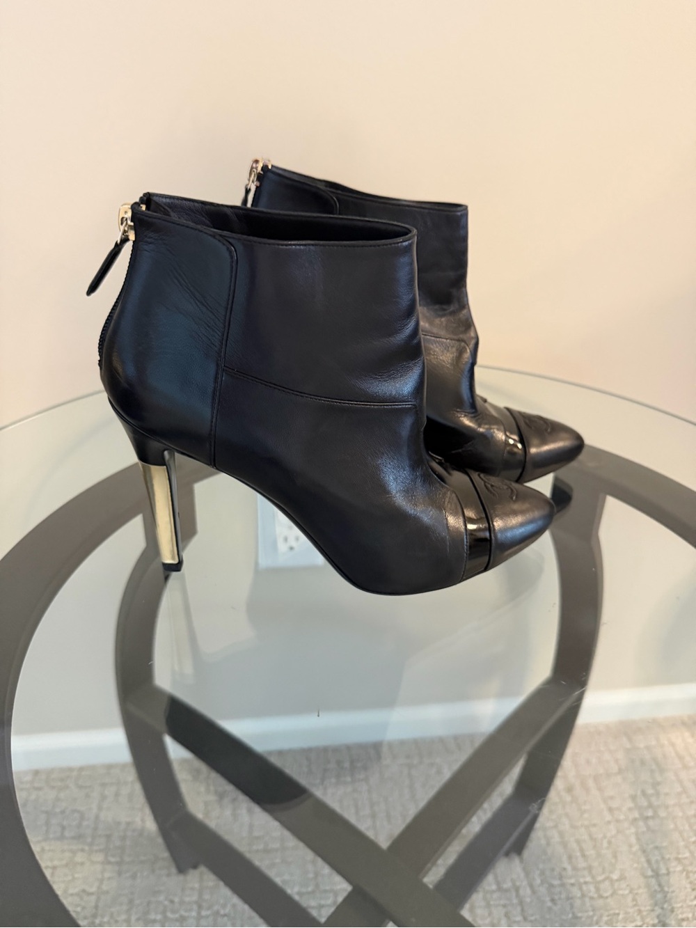 CHANEL Black Leather Ankle Booties with Gold Heel Accent